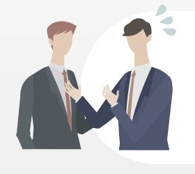 仕事で英語を使う場面を思い浮かべる会社員